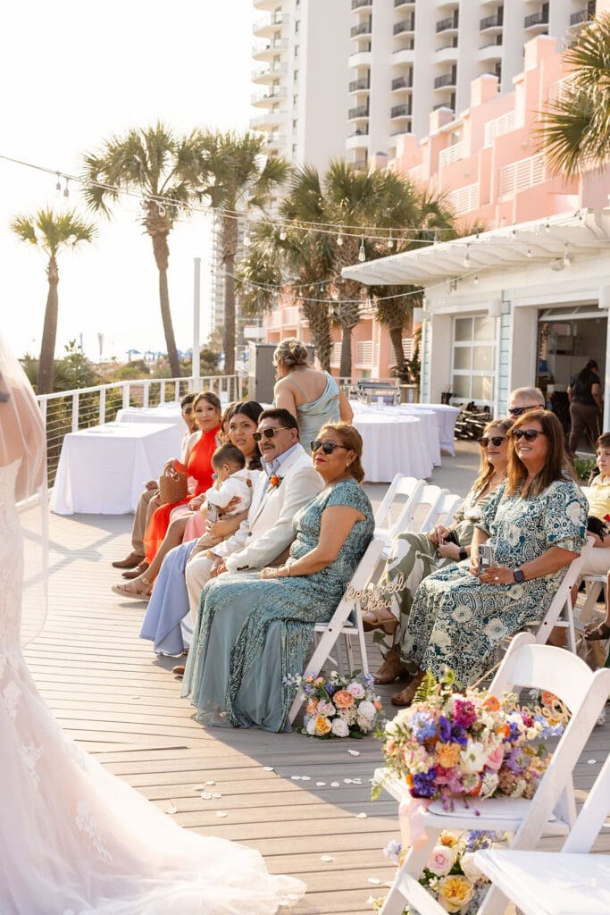 Family of the bride watches and celebrates as couple say their vows at Florida wedding | Madison Abernathy Photography