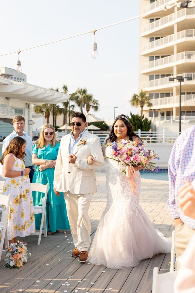 Father walking the bride down the aisle to hand over to the groom and say their vows in front of a preacher | Madison Abernathy Photography
