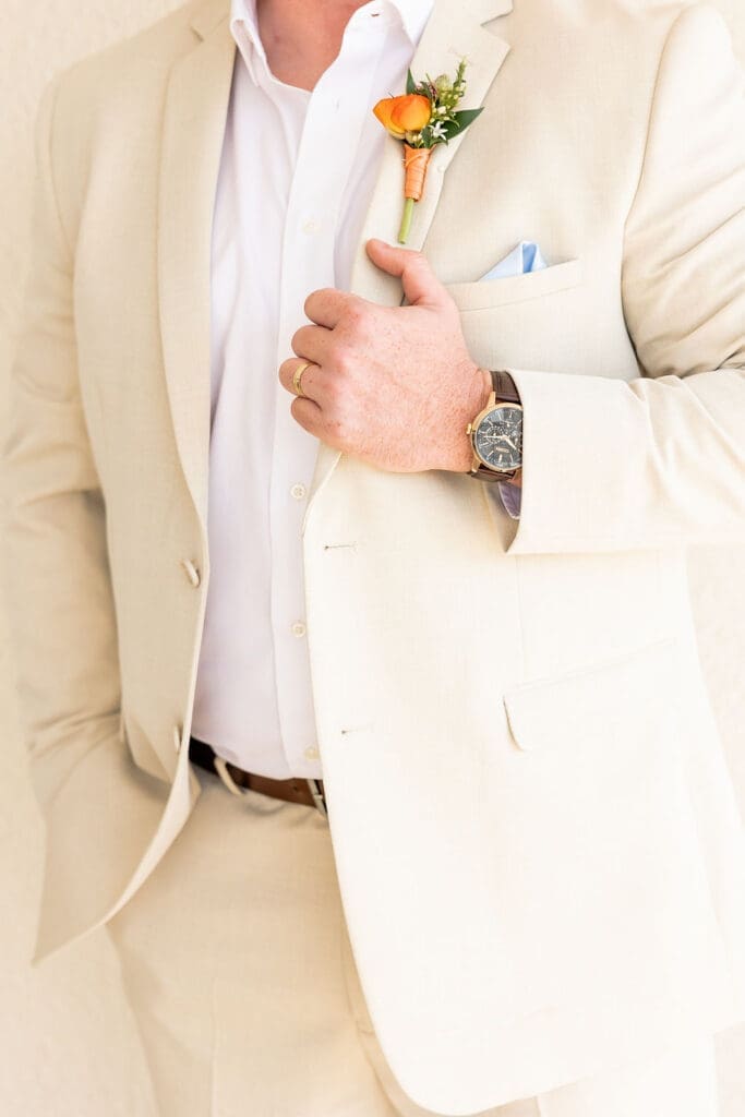 Groom's cream jacket with luxury watch | Madison Abernathy Photography
