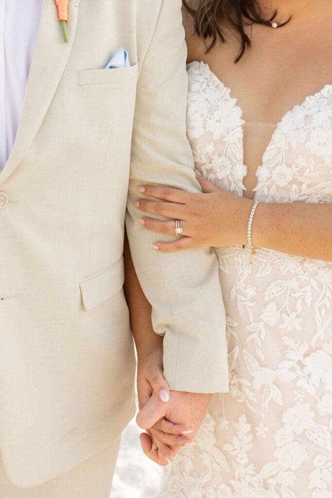 Bride and groom holding hands on the beach | Madison Abernathy Photography